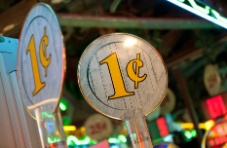 A close-up photo of 1c penny slot levers on a blurry background