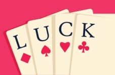 An illustration of four suited cards spelling ‘luck’ against a pink background